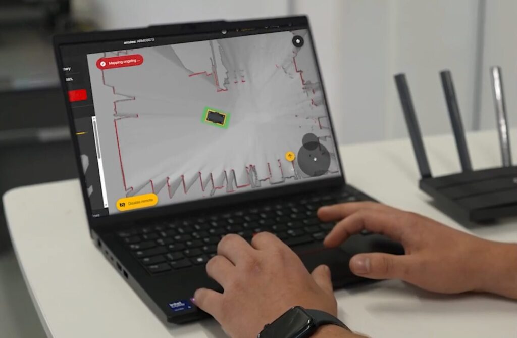 A developer setting up robot demos by creating layout inside the fleet manager on the demo kit laptop
